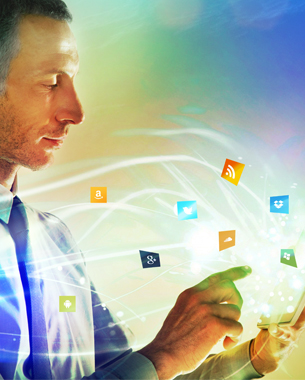 Man using tablet with app icons flying around