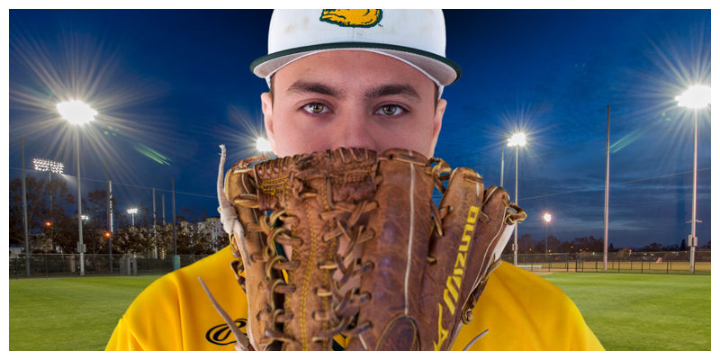 Photo of Brady Probasco holding a baseball glove over his mouth