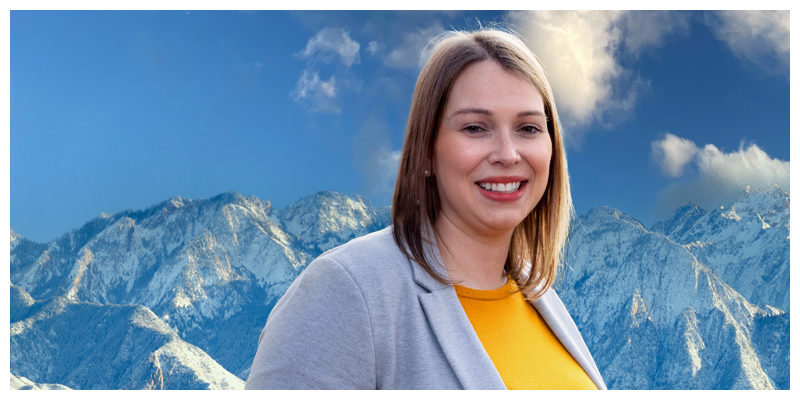Photo of Whitney Klemm with mountains in the background